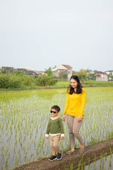 mother and child who were walking in the fields happily