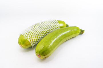 Fresh zucchini on pure white background