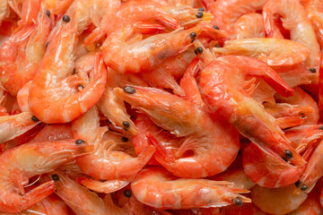 Shrimps background texture. A lot of shrimps. Cooked shrimps.