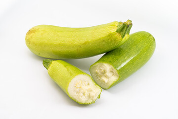 Fresh zucchini on pure white background