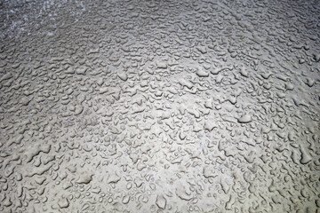 Rain or water drops on metal surface.