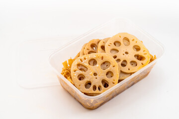 Spicy tofu skin lotus root slices on pure white background
