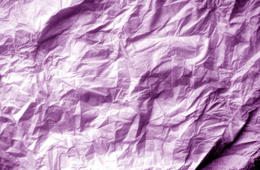 Crumpled white paper background in purple tone.