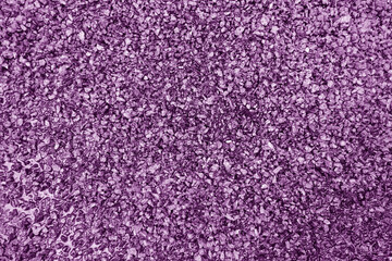 Asphalt road closeup in purple tone.