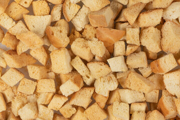 Background texture of baked crackers. heap small pieces dried bread. crumbs of bread croutons