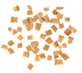 Baked crackers isolated white background close up. heap small pieces dried bread. crumbs of bread croutons