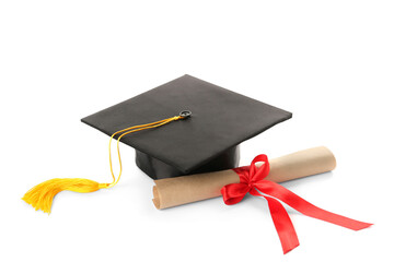 Graduation hat and diploma on white background