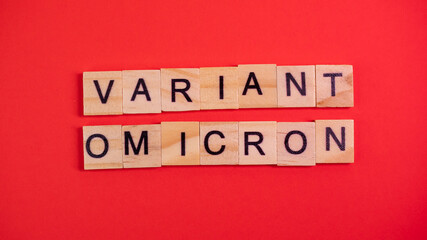 Omicron variant displaces Delta. Emergence of new dangerous strain of coronavirus COVID-19 Omicron. Words omicron variant on colored red background