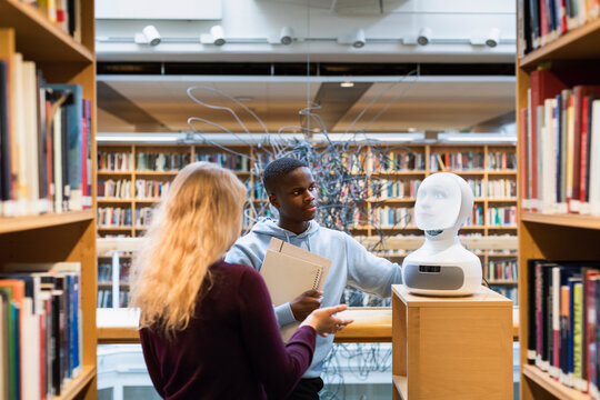 Students Using Voice Assistant In Library