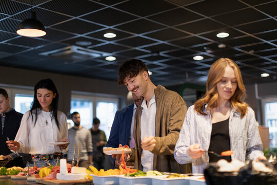 People choosing food in buffet