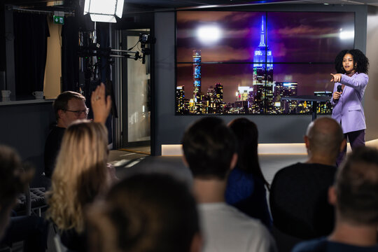 TV show audience member raising hand