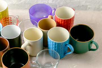 empty mugs of different shapes and sizes on the table