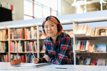 Young woman studying in library