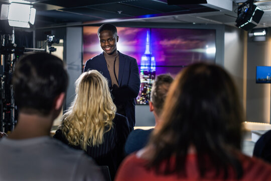 TV show host interviewing audience member