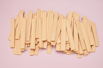 Cookie sticks on a pink background.