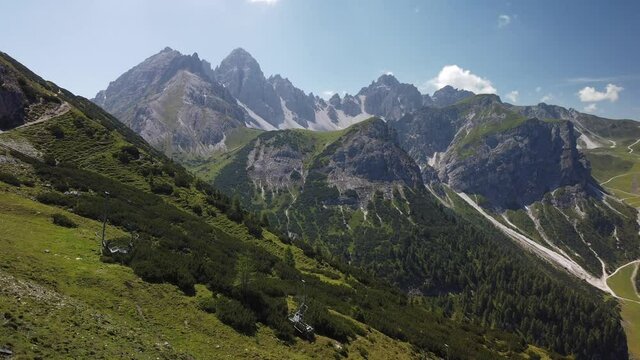 Time lapse of Axamer Lizum Valley with hoadl peak, the olympic ski resort close to innsbruck, with sun and blue sky in july
