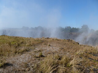 Mist of Victoria Falls of River Zambesi, Zambian shore, Unesco World Heritage Site, Livingstone, Zambia