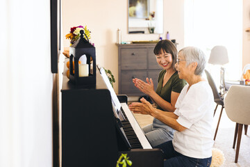 Cheerful Family Learning Piano Together At Home