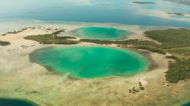 Honda bay with tropical islands and sandy beaches surrounded by coral reef with azure water, aerial view. Summer and travel vacation concept, Puerto princesa, Palawan, Philippines.