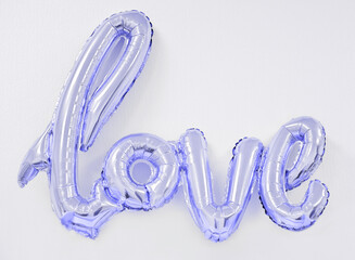 inflatable word love in Very Peri color of the year 2022. trendy balloon for holiday celebration