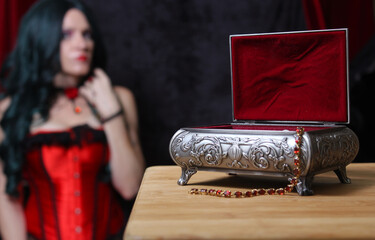 Jewelry Box with Woman in Corset in background, Shallow DOF, Focus on Jewelry Box