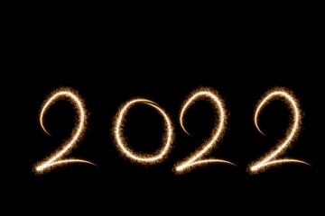 Happy new year 2022 text with Sparkle firework on black background. Bengal flame lights
