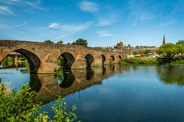 The Medieval Devorgilla Bridge, reflecting on the River Nith