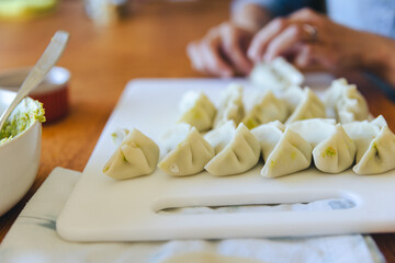 Fresh Raw Dumplings On Cutting Board