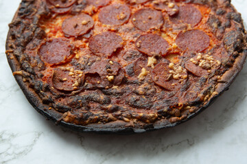 pepperoni pizza on marble counter