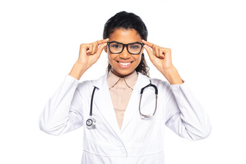 Smiling african american oculist holding eyeglasses isolated on white.