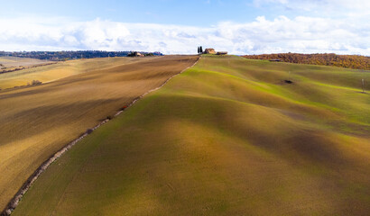 Fototapeta na wymiar Colorful Tuscany in Italy - the typical landscape and rural fields from above - travel photography