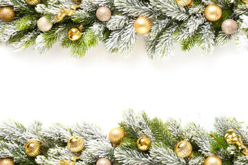 Christmas frame with gold baubles on snowy evergreen branches isolated on white background. Copy...