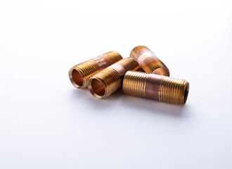 Brass nipples 1/2", pipe connector for Water on white background. Closed up.