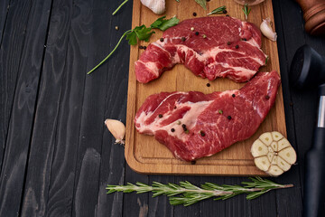 meat on wooden board vegetables and ingredients for cooking wooden background