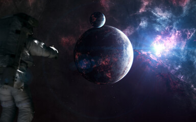 Inhabited planets of deep space. Astronaut out of focus. Science fiction. Elements of this image furnished by NASA