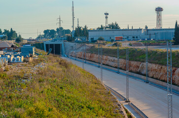 Fototapeta premium Underpass and tunnel for the construction of a new railway line. Detail of sewage and metal lattice ducts for the electrification of the railway line.
