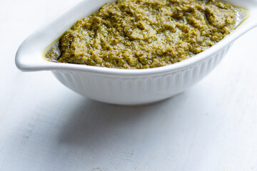 bowl of basil pesto sauce