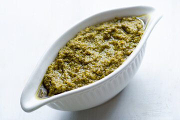 bowl of basil pesto sauce