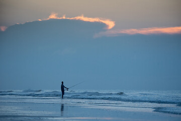 Sunrise surf fisherman on Hilton Head Island, South Carolina