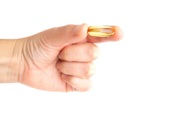 Omega-3 capsule in hand isolated on white
