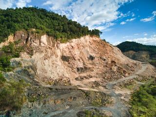deforestation of green forest hill for quarry