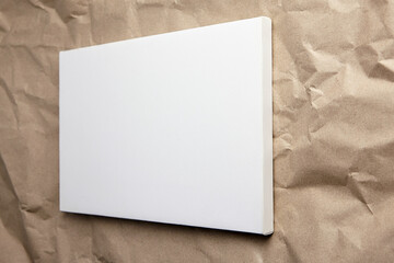 White canvas mockup on craft paper