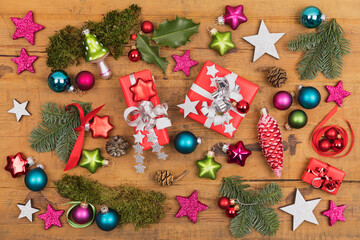 Collection of Christmas themed items flat laid on wooden surface