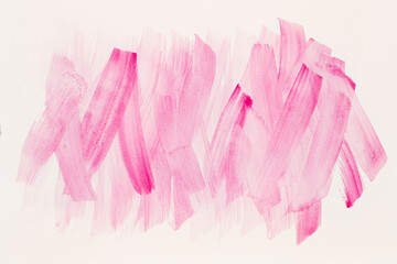 Abstract pink watercolor on white background.The color splashing in the paper.It is a hand drawn.