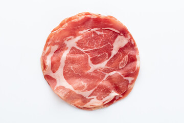 Italian prosciutto crudo or jamon. Raw ham. Isolated on white background.