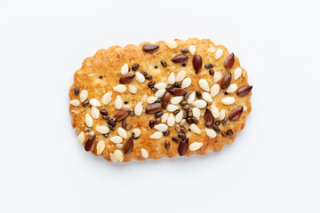 Tasty crackers with seeds on the white background.