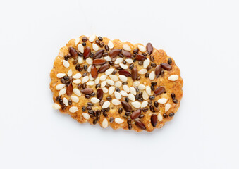 Tasty crackers with seeds on the white background.