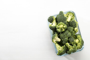 Washed And Sliced Broccoli Crown In Glass Container.V