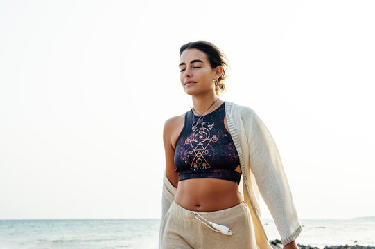 Woman with eyes closed at beach
