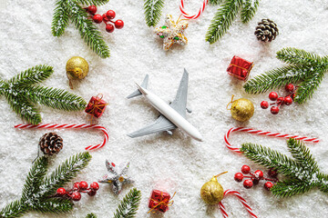 Travel for Christmas. Airplane with Christmas decor.New year.Selective focus.